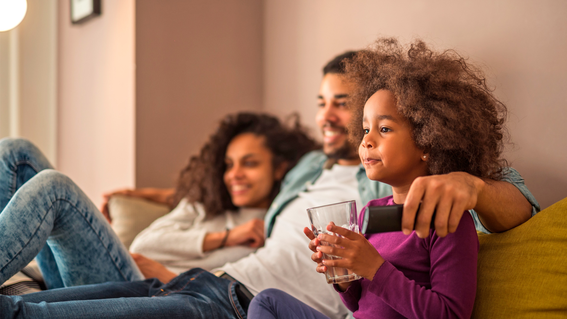 family watching tv together remote control