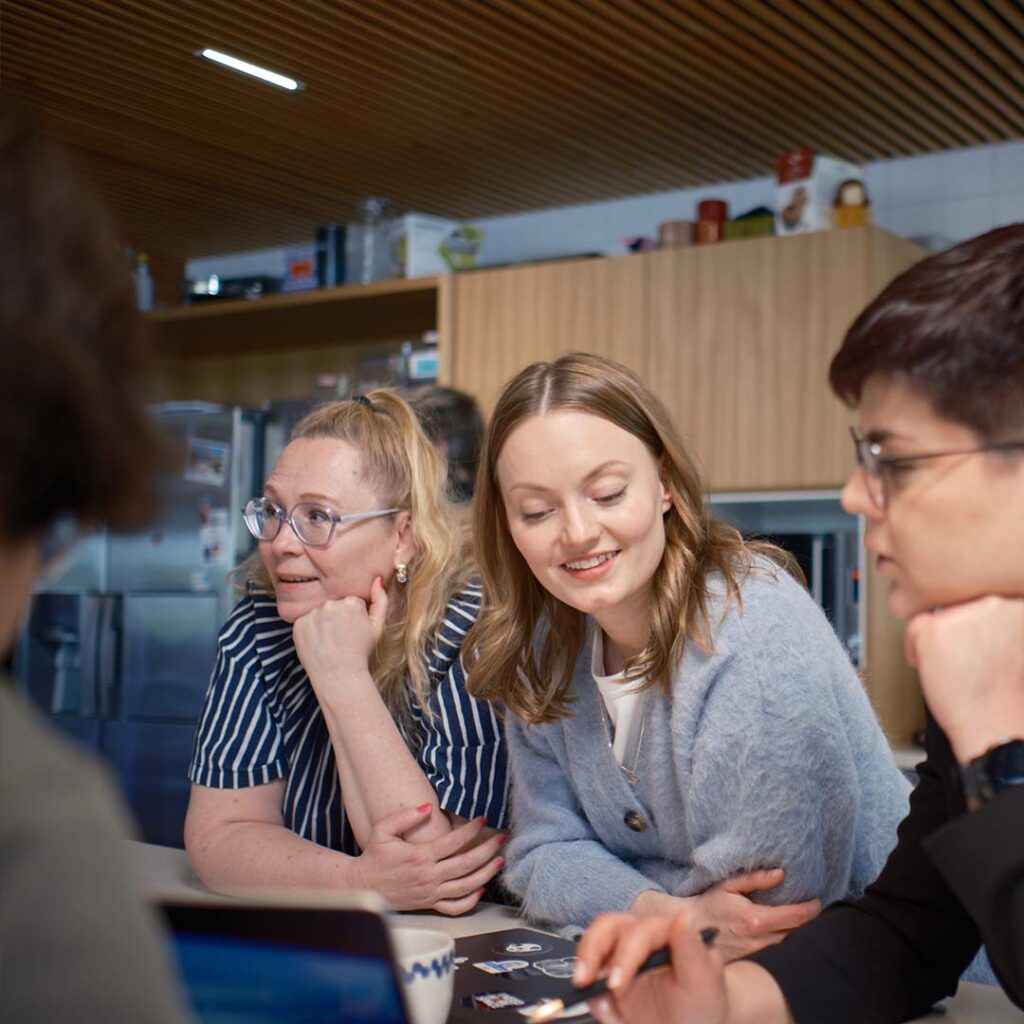 Group of Tuxera employees talking together