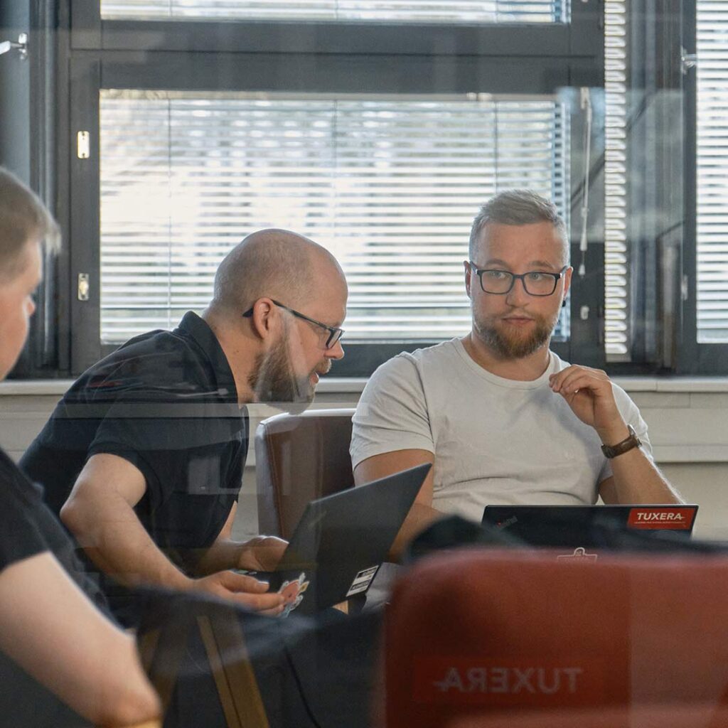 Tuxera engineers are seriously working at their computers