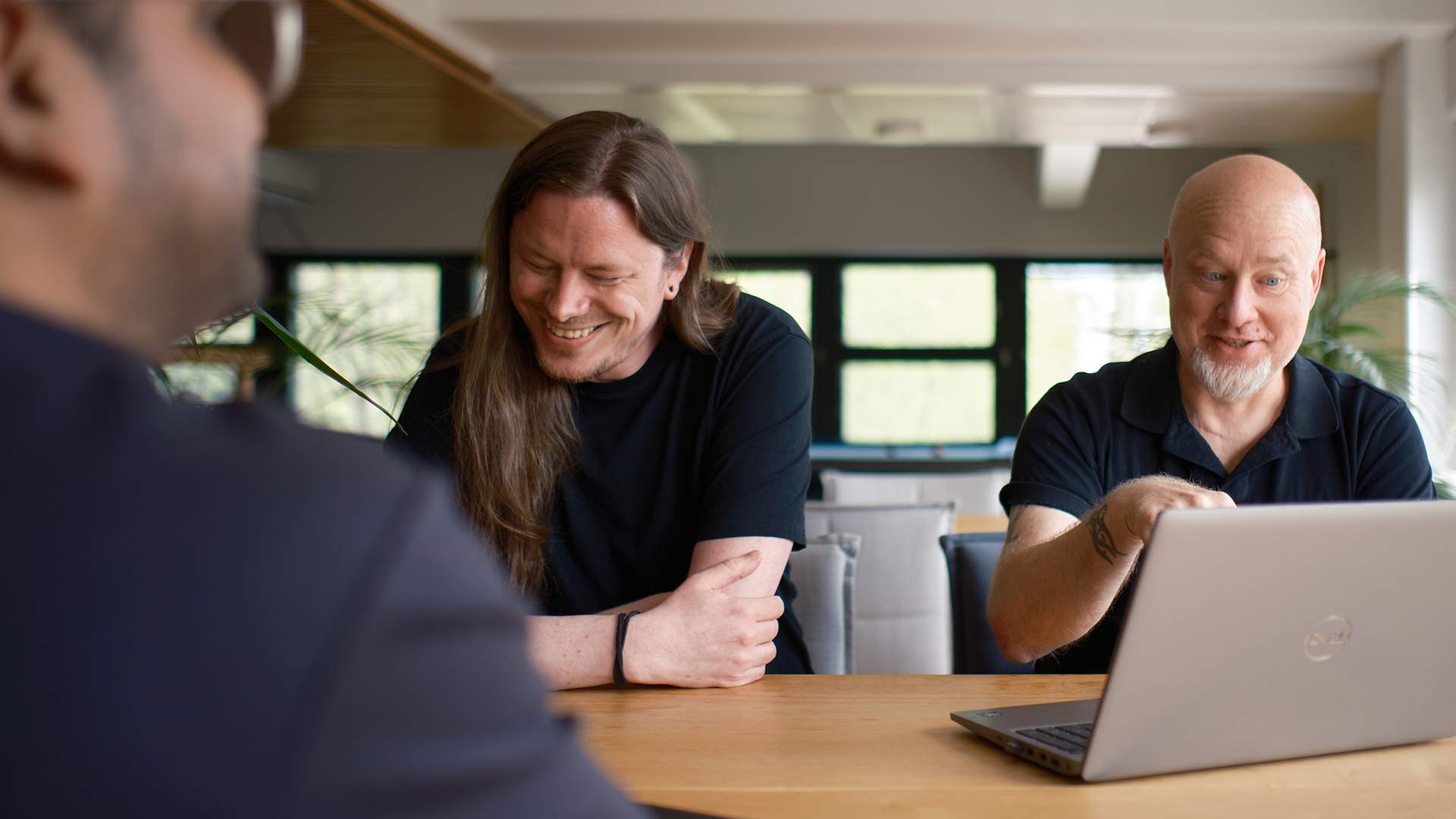 Tuxera engineers laugh together